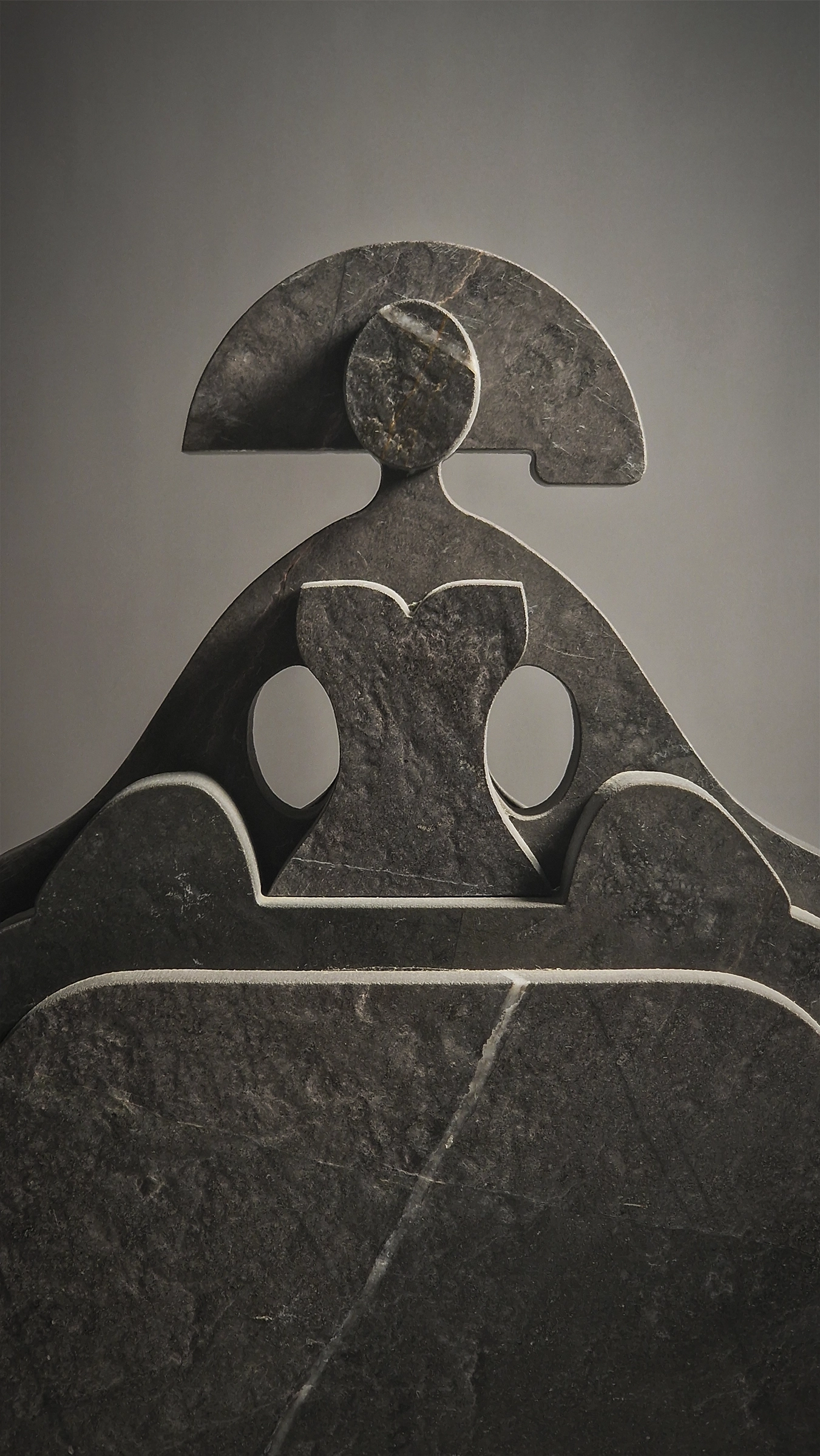 A ceramic figure casting its shadow